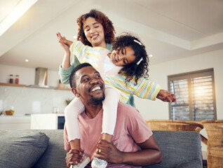 Black family, father and daughter playing with mother on living room sofa together for fun bonding...