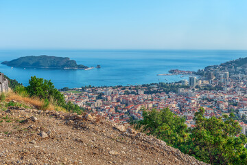 Top view of the city and the Adriatic Sea from the Viewpoint on Budva on the M2.3 highway in Montenegro. Beautiful panorama with the Sveti Nikola Island on the background of the sea horizon