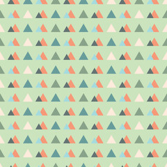 colorful pyramid triangles with pastel green background seamless geometric pattern