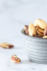 Bowl of brazilian nut on the table, known as 