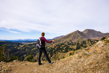 Fototapeta premium Young hiker girl enjoying in Camporrells, Pyrenees, France
