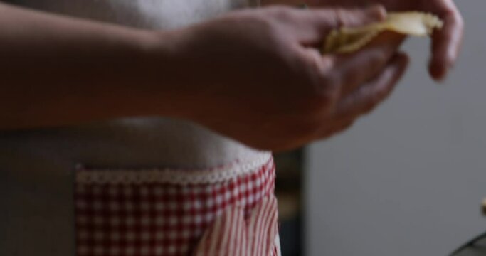An enchanting dance of hands unfolds as chebakia takes its final form, a testament to culinary craftsmanship