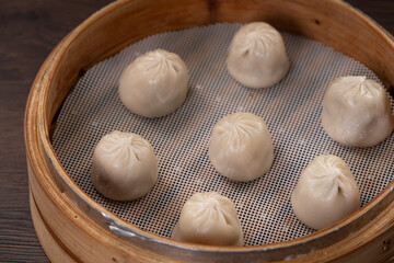 Steamed pork soup dumplings named Xiao long bao in Taiwan.