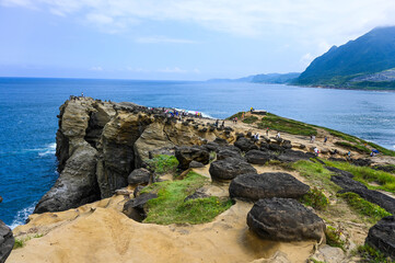 New Taipei, Taiwan - SEP 14, 2019: Many people come to visit Mushroom rock by the sea in shenao.