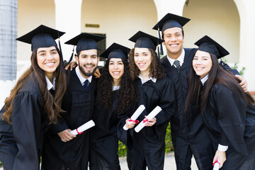 Happy group of friends graduating university