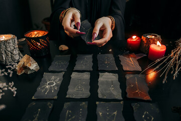 The woman's hands are holding a magic card. Halloween