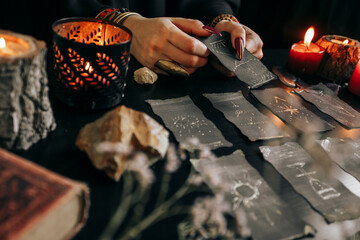 The woman is holding a smoking dry wood in her hands. Halloween