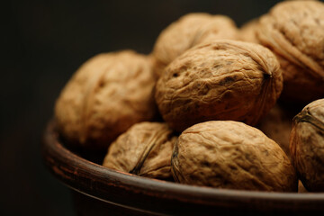 Walnut close up on a wooden table. Walnut close up. product rich in minerals and vitamins.