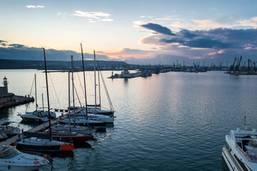 Fototapeta premium Aerial view of Yachts and boats in the port at sunset. Black sea, Varna, Bulgaria.