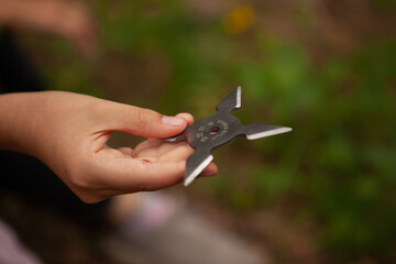 Shuriken lies on a tree and in hand