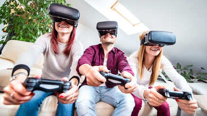 Obraz premium Trendy people playing with vr glasses at shared apartment - Virtual reality and wearable tech concept with happy friends having fun with headset goggles