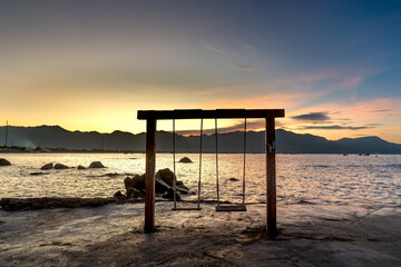 Dawn at a natural rock on the beach in Hon Co tourist area, Ca Na, Ninh Thuan province, Vietnam