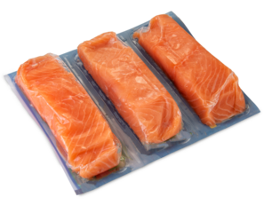 Salmon slices in vacuum packed sealed for sous vide cooking isolated on white, clipping path included
