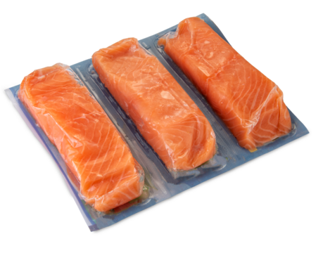 Salmon slices in vacuum packed sealed for sous vide cooking isolated on white, clipping path included