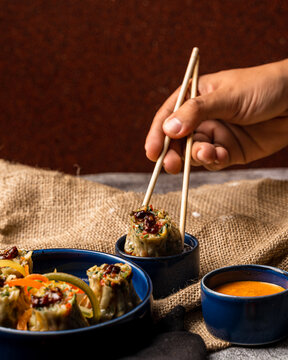 dimsum being picked up by chopstick