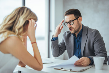 Furious businessman shout at female employee working in shared office, mad male boss scream at guilty intern, blaming for mistake, CEO accuse woman worker in company failure or bad results