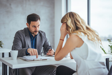 Mad male worker yelling at female colleague asking her to leave office, multiracial coworkers...