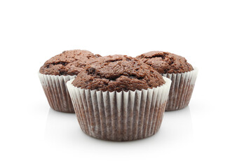 Three chocolate cupcakes or muffins isolated on white background close-up    