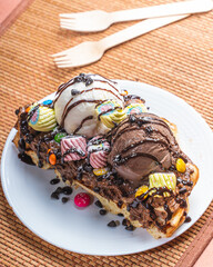 chocolate waffle with ice cream on top 