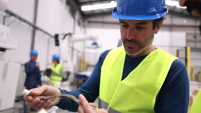 coworkers in the robotized workplace discuss how to optimize automation for productivity and safety