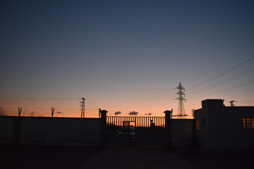 Fototapeta na wymiar sunset with overhead power line