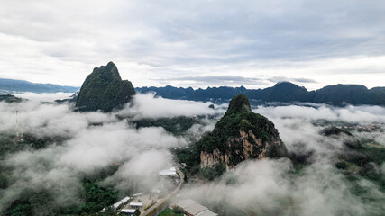 Aerial View of limestone mountain morning mist surrounding Phang Na City in Krabi Province Thailand