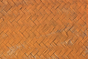 Background image of a house wall made of woven bamboo