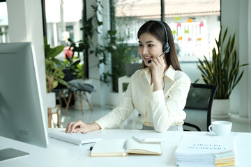 Fototapeta na wymiar Confident asian businesswoman talking to the camera video calling video conference with his business partners in office.