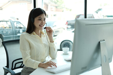 Confident asian businesswoman talking to the camera video calling video conference with his business partners in office.