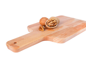 Walnuts on a cutting board cut out on a transparent background
