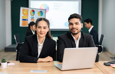 Asian business people team analyzing statistics financial. Team of businesspeople Meeting Conference Discussion Corporate Concept in office.