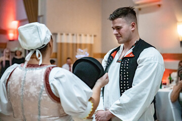 Slovak folk dance traditional wedding. Young groom and bride in folklore dress. Traditional...