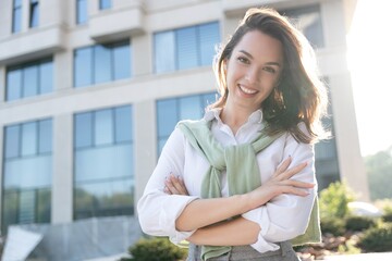 Businesswoman portrait. Caucasian female business person standing outdoor looking at camera