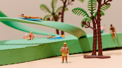 Obraz na płótnie Canvas miniature summer people around a green flip-flop