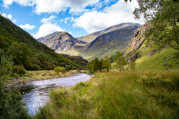 Fototapeta na wymiar Hike through a classic panorama of a Scottish landscape