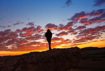 Silhouette Of Man Alone At Sunset