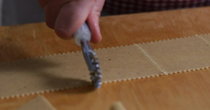 Culinary Precision: Sculpting Chebakia Dough with a Pastry Cutter. The Chef's Hands Craft the Dough into Exquisite Shapes