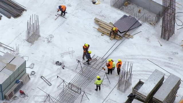 Group of workers discussing problems at the construction site