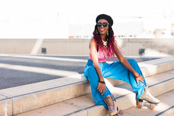 Urban woman enjoy outside. Modern woman posing with roller skates