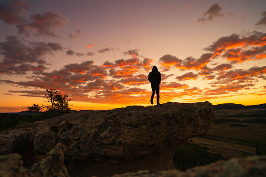 Silhouette Person Walking Into Sunset