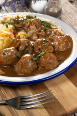 Minced meat balls in mushroom sauce.