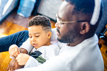 Fototapeta premium authentic ethnic multicultural people in living room day sunlight