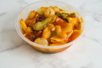 rujak aceh is Indonesian mixed fruit salad made from mixed fruit anf mango kweni sauce and chili