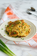 telur goreng, fried egg or omelette in white ceramic plate