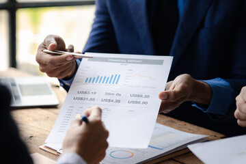 Businesswomen are opening up their laptop's financial information for business partnerships, they are planning to manage their finances and solve common problems. Concept of business administration.