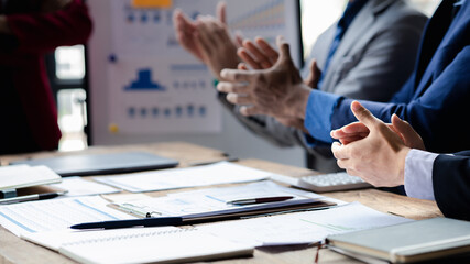 Group business people applauding at startup company meeting, business meetings, startup company sales team meetings, brainstorming and summary company performance. Business strategy management concept