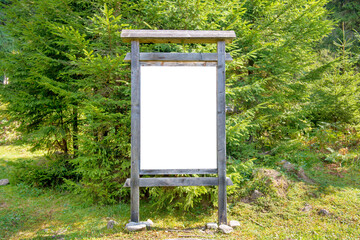 White blank sign board in green park in PNG isolated on transparent background - 583537375