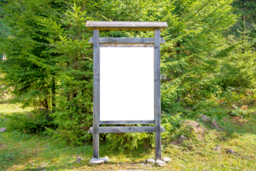 White blank sign board in green park in PNG isolated on transparent background