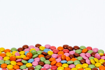 Fototapeta na wymiar Colourful candy on white background, copy space, template of Easter season