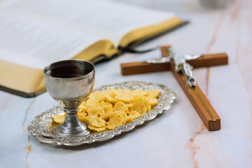 Holy communion of Christians consists unleavened bread chalice wine other signs symbols Jesus Christ